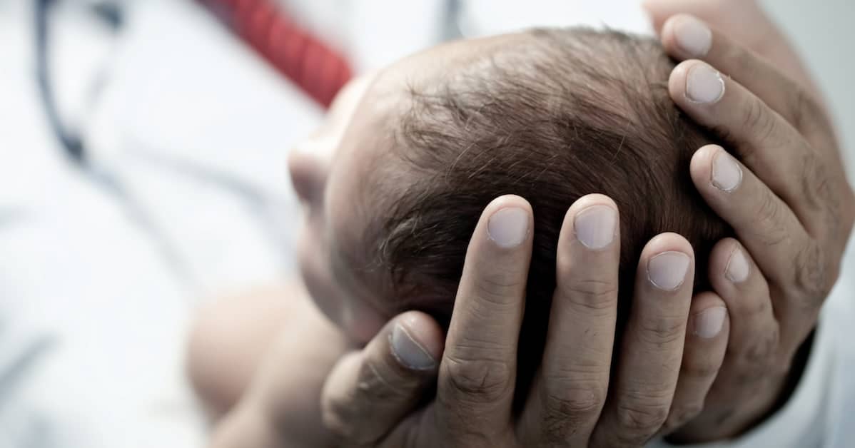 doctor holding baby