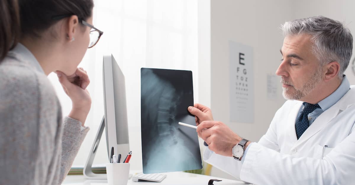 Doctor explaining x-ray results to patient