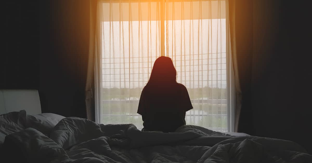 Woman with TBI looks out window | Mandell, Boisclair and Mandell, Ltd.