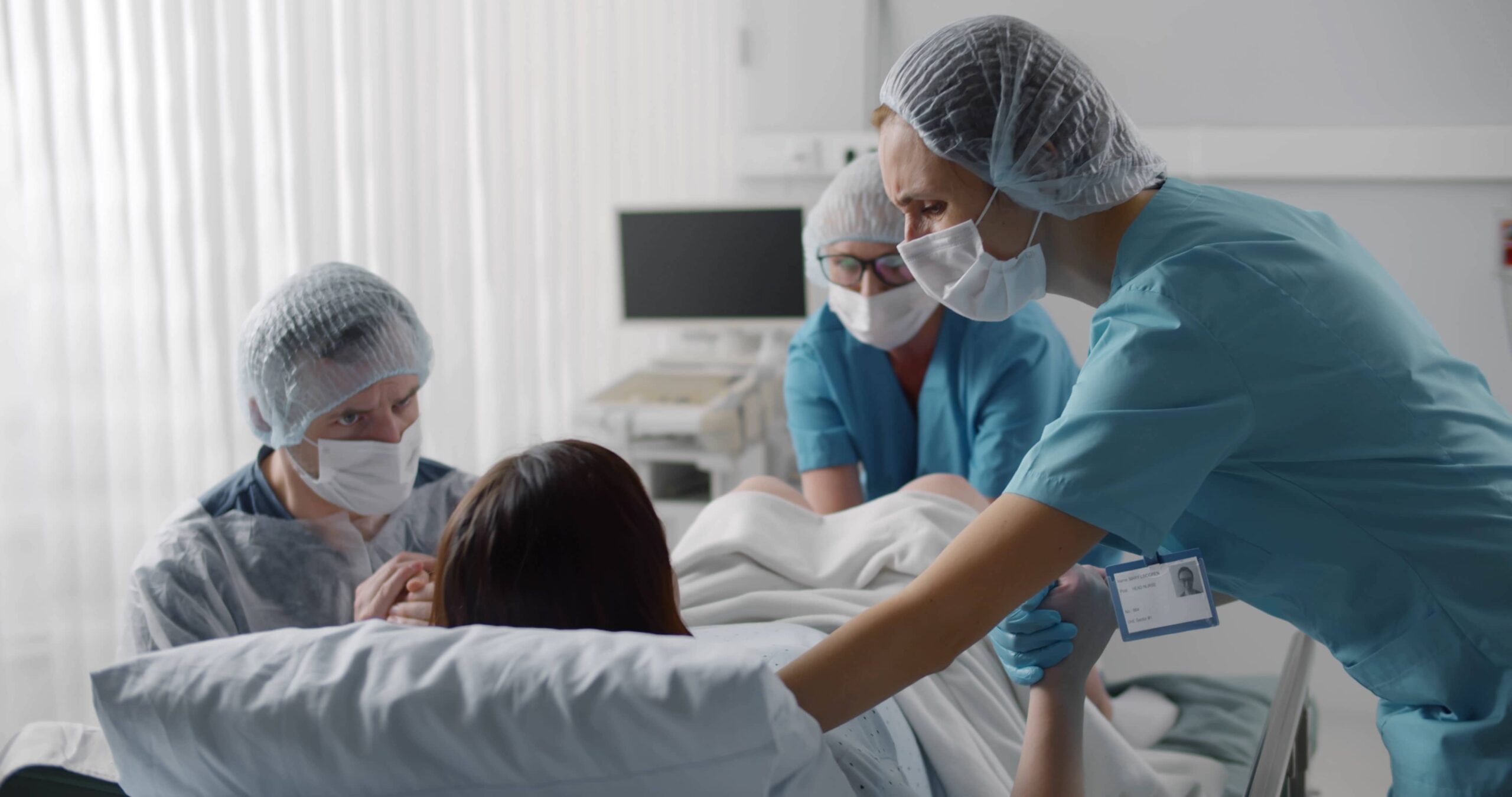 nurses surround a woman during childbirth | Mandell, Boisclair and Mandell, Ltd.