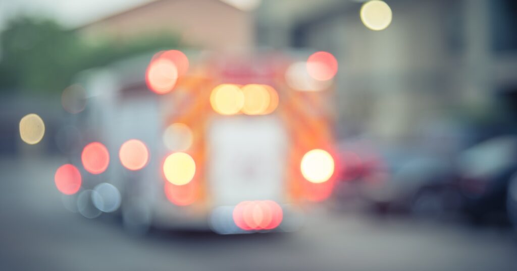 Blurred image of an emergency vehicle on the way to a motor vehicle accident